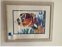 Front view of framed fish artwork showing full image, matting and frame