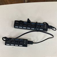 Both USB hubs showing port arrays and attached cables