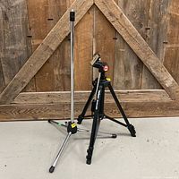 Full view of Apex microphone stand and Velbon Stratos 460 tripod standing side by side