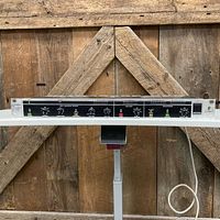 Front wide view of Behringer Ultrabass Pro EX1200 mounted on shelf