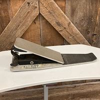 Side view of Drum Tech Fat Kat pedal showing spring mechanism and brand marking