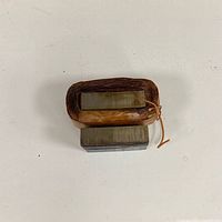 Top view of electromagnet showing copper coil and iron core
