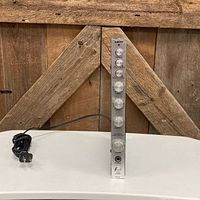 Front view of Keny BA2360 amplifier showing silver faceplate and control knobs