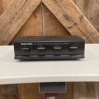 Front view showing brand name and four push-button selectors