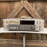 Front three-quarter view of Tascam DA-60 DAT recorder on shelf