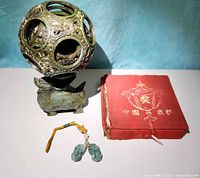 Sphere on stand, jade charms and closed Xiangqi box grouped