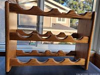 Front view showing full 4-row 12-slot oak wine rack