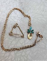 Necklace and bracelet laid out showing design and stones