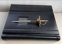 Album with letter opener on top for scale