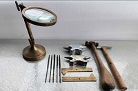 All items overview: magnifier, files, anvils, hammers, calipers