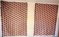 Both textiles hanging side by side on wall showing size and matching pattern