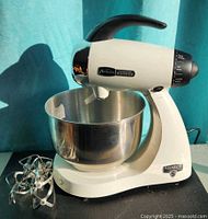 Overall view of Sunbeam Mixmaster Heritage Series mixer with stainless bowl and paddle attachments