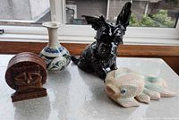 All four items: Scottie dog figurine, tiki coaster set with holder, wooden fish, Sarawak vase