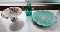 Overall view of marble tazza, Murano glass vase, and enameled plate