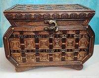 Front and side view of wooden box showing bamboo weave pattern and brass latch