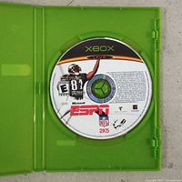 Front of ESPN NFL 2K5 Xbox game disc inside green case