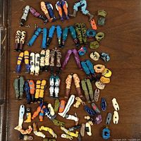 Overhead view of entire assortment of figure parts spread on tabletop