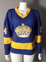 Front view of blue and gold Los Angeles Kings jersey with crown crest