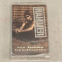 Front view of cassette case displaying cover art and title