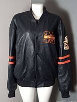 Front view showing NY Islanders chest logo, snap closure, pockets and overall condition