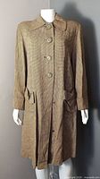 Front view of brown micro-check vintage coat on mannequin