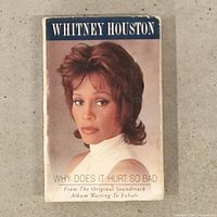 Front of cardboard sleeve featuring Whitney Houston portrait and title