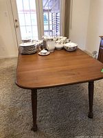 Full view of tabletop and legs, leaves installed
