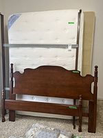 Front view of mattress, box spring, headboard and footboard