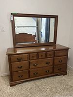 dresser with attached mirror front view