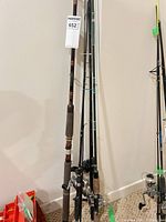 Group of four rods standing upright, length view