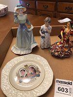 Overview showing all three figurines and commemorative plate