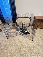 Overall view of exercise pen assembled with accessories inside