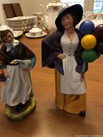 Both Royal Doulton figurines side by side