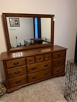Full view of dresser with attached mirror