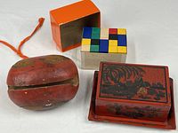 All four items in lot: lacquered box on tray, wood fish drum, colored block set with box