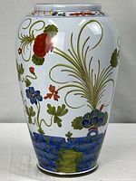 Front view of hand-painted porcelain vase showing floral design