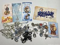Overview showing rosaries, medals and prayer cards