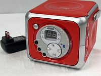 Front view of Jensen CD-555 boombox with power adapter