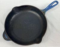 Top view of 10.5-inch skillet showing interior surface, handles, spouts