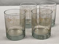 Four matching rocks glasses grouped to show overall set