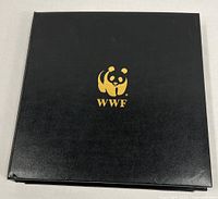 Closed black WWF binder with gold panda logo
