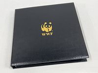 Closed black WWF album with gold panda logo