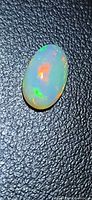 Top view of oval Ethiopian opal showing play of color