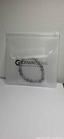 Bracelet in branded CRWN GEMS zip pouch