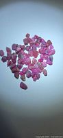 Group of rough ruby crystals on white background
