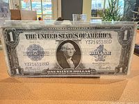 Front view of 1923 $1 silver certificate in sleeve