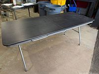 Table unfolded showing full surface and legs