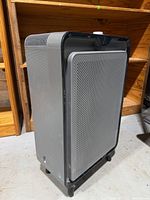 Front and side view of grey Bissell air220 air purifier