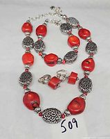 Full view of necklace, bracelet and earrings showing design and size