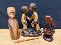 Group view of all four carved wood items